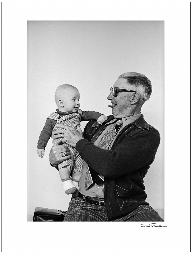 Emil Makalous entertaining a Baby, Cuba, Kansas